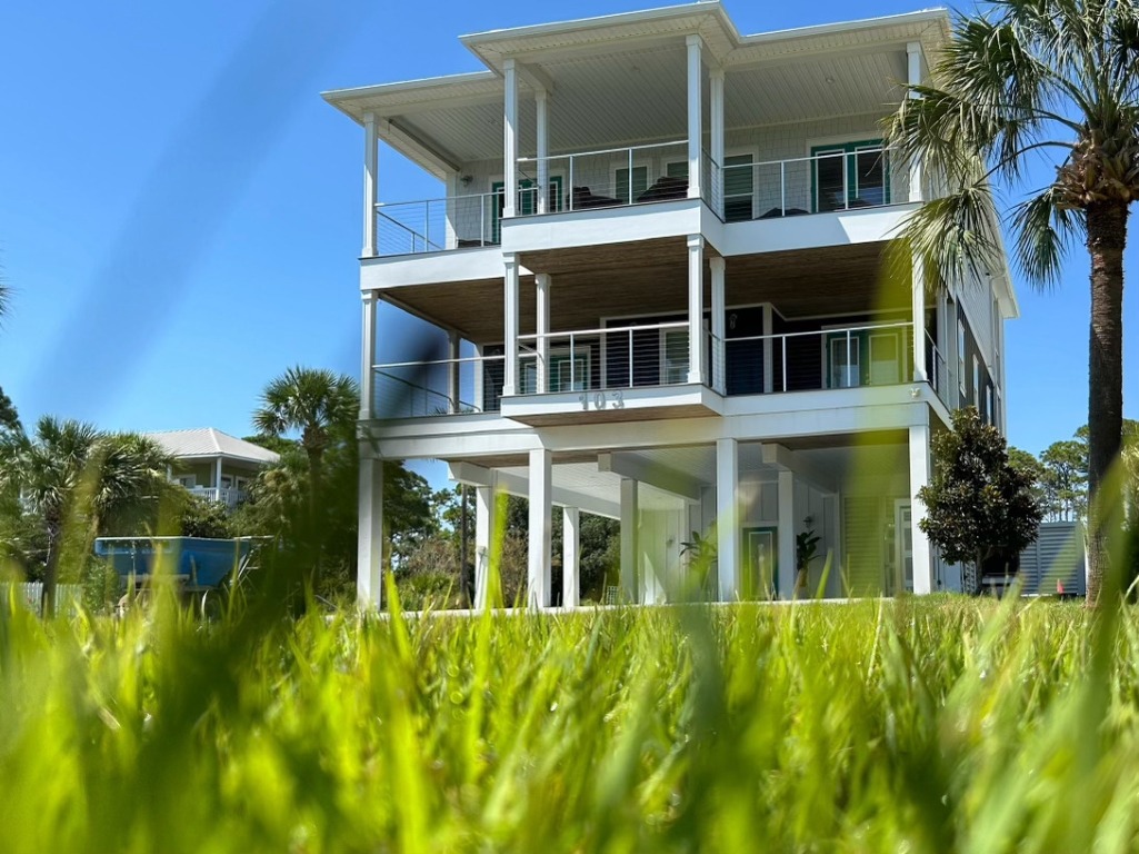 Flawlessly manicured grass in a well-maintained front yard